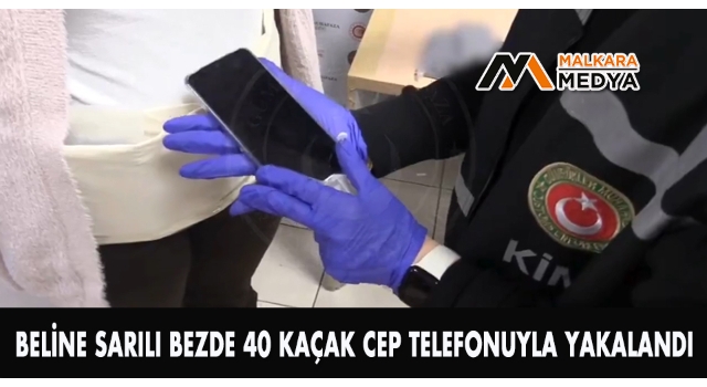 Beline sarılı bezde 40 kaçak cep telefonuyla yakalandı